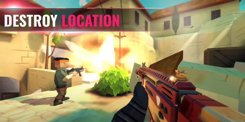 First-person view aiming a rifle down a sandy street while an enemy takes cover behind a wall and a blast lights up the background. Text reads 'Destroy location'.